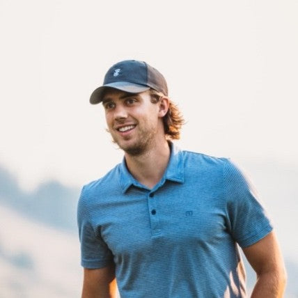 Ben Magnuson, founder of Fairways, on a golf course at sunset